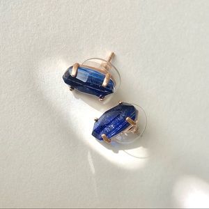Kendra Scott stud earrings. Gold or rose gold with blue sapphire color stones.